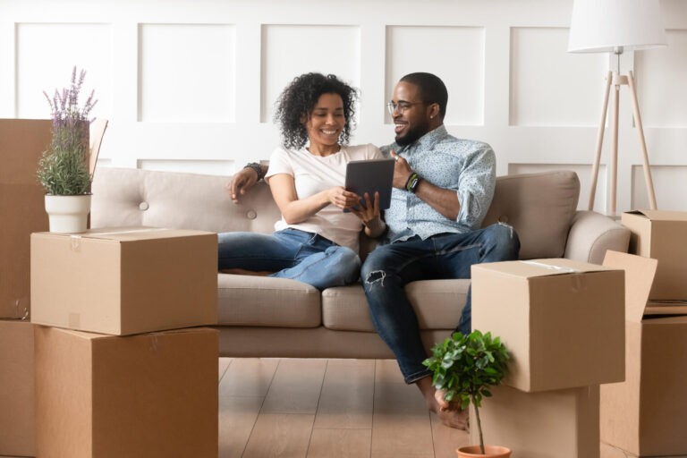Happy couple moving into a new home.