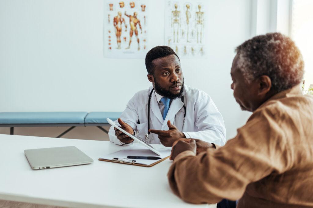 Senior patient speaking with doctor