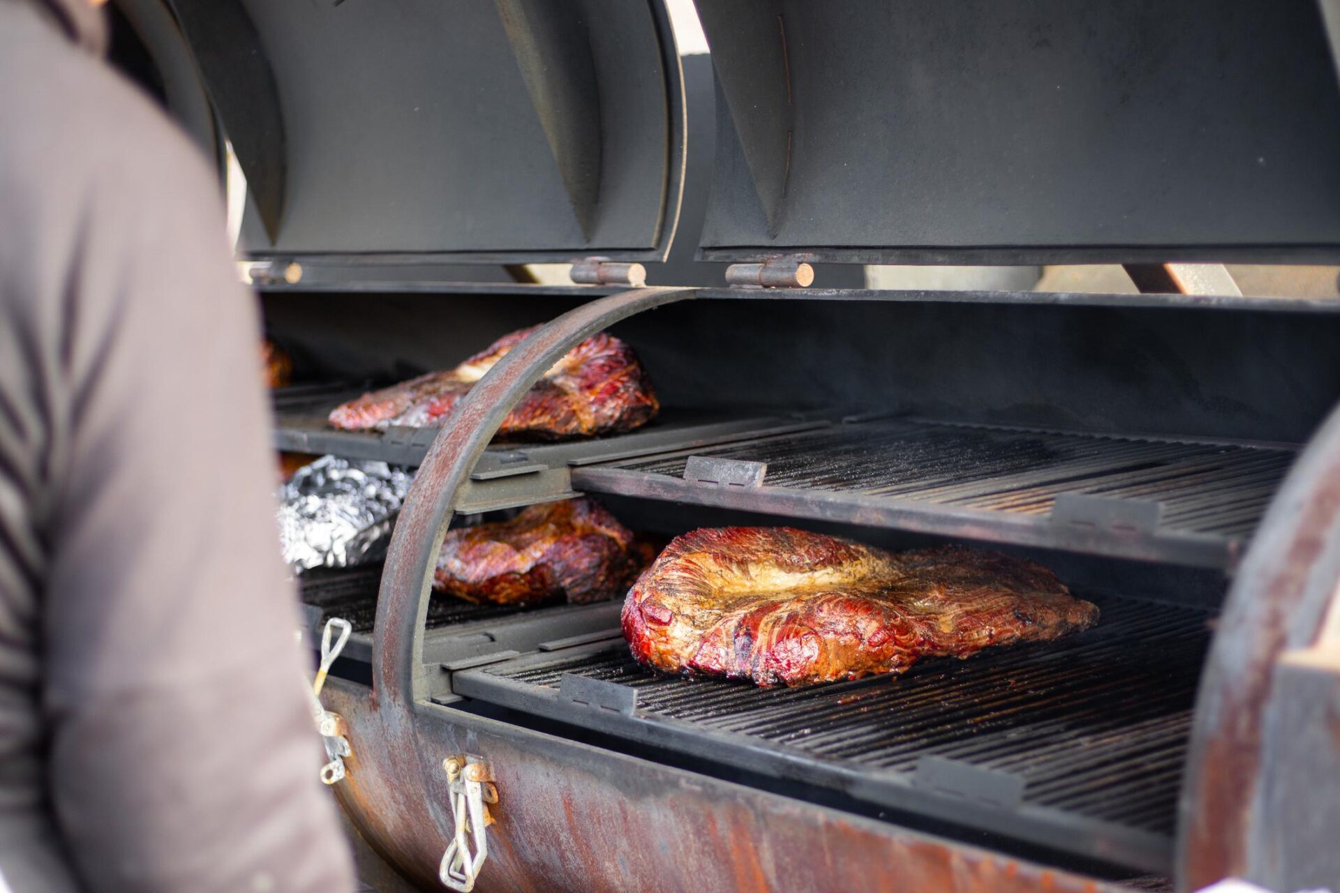 A large piece of lamb tenderloin being smoked