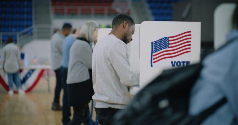 Man at a voting booth