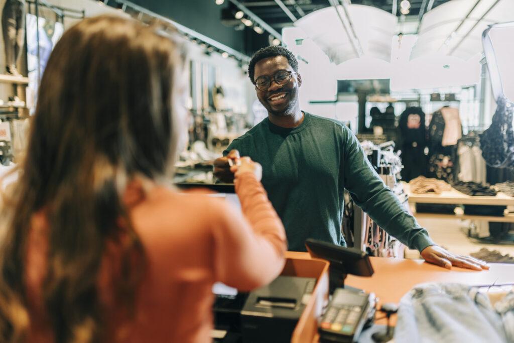 Customer paying for their purchase at a retail store. 