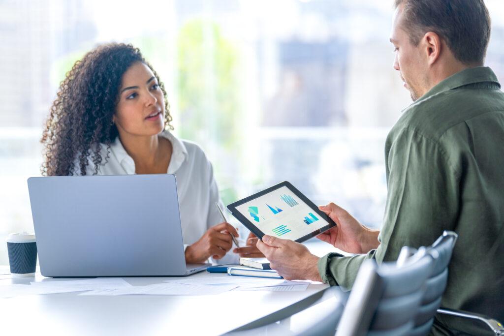Woman and man going over accounting information