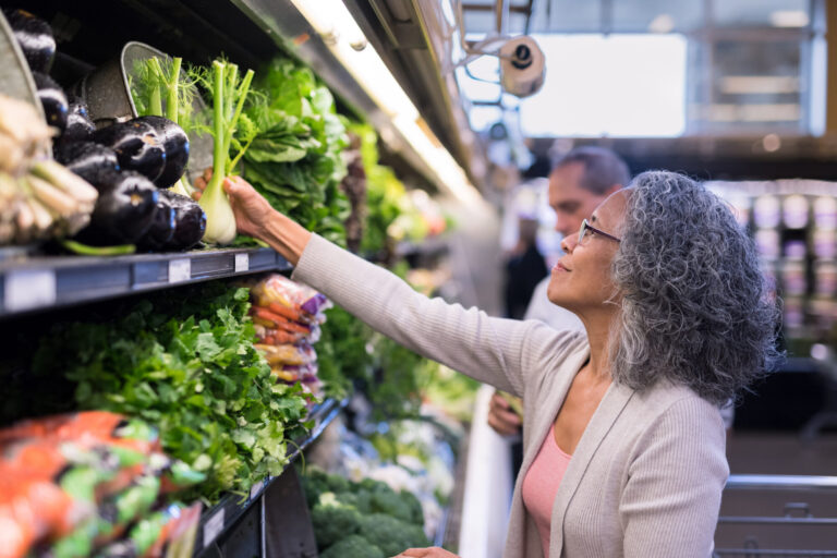 Black woman picking out healthy food